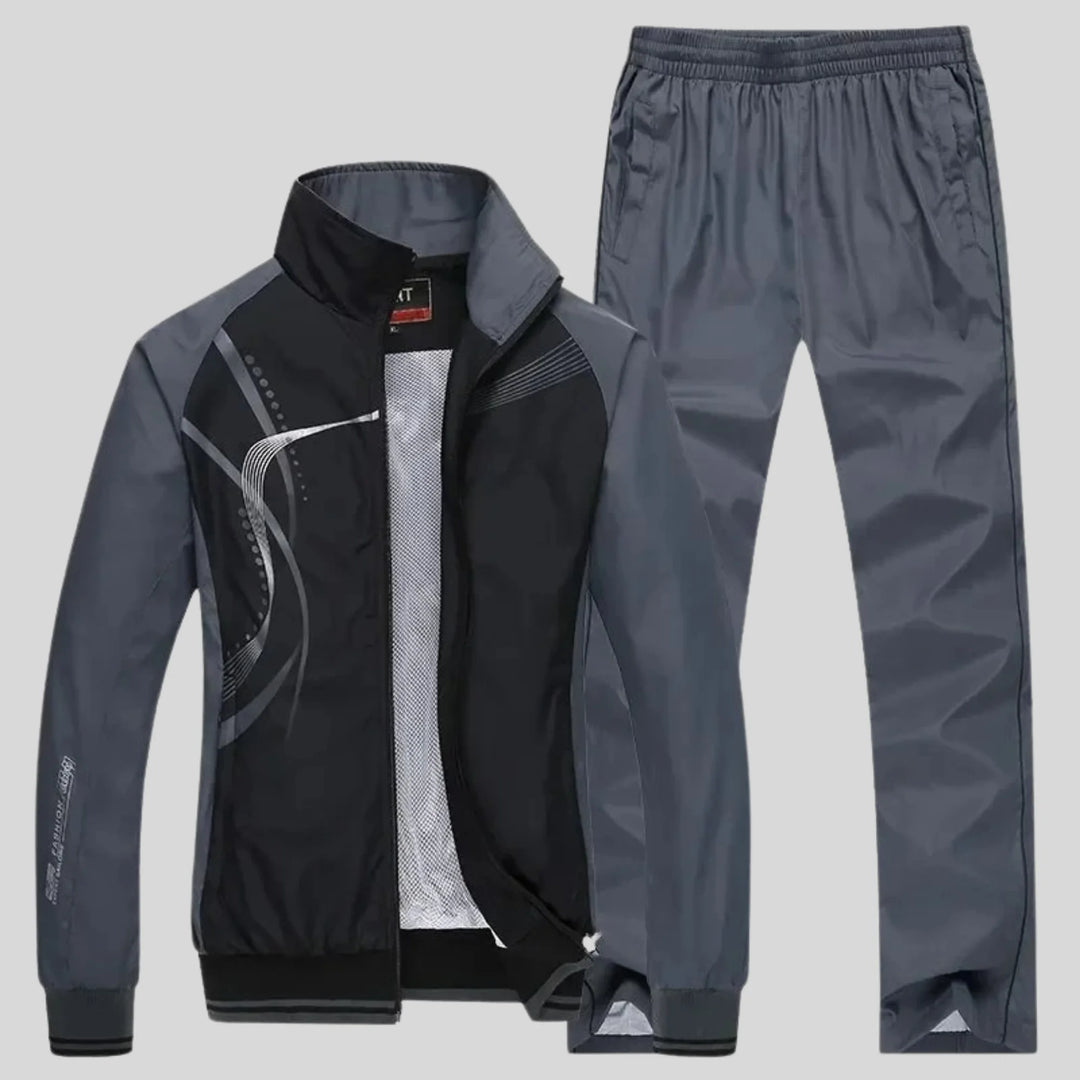 Black Athletic Men's Sweatsuit With Curved Design - Studio Pose